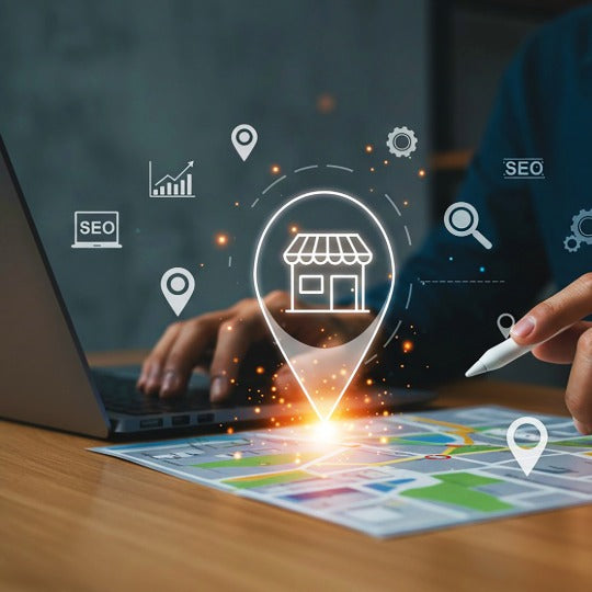 Person using a laptop with digital icons related to SEO and location services on a map.