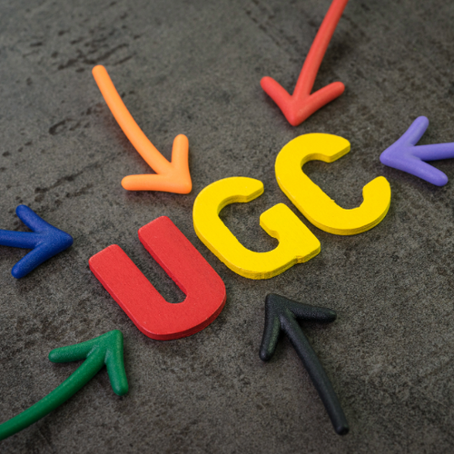 Colourful UGC, User Generated Content, with arrows pointing towards it on a dark textured background